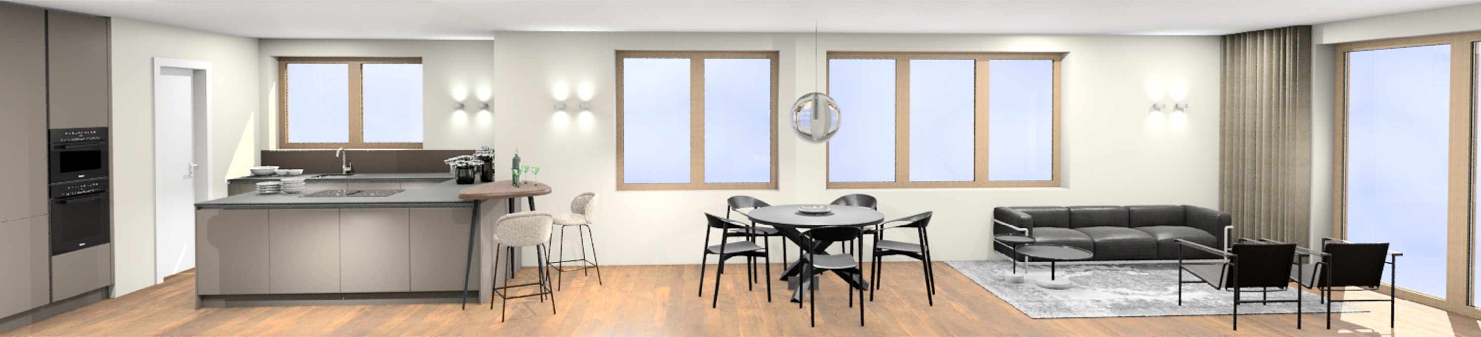 Offene Wohnküche mit grauer Küchenzeile, Barhockern, Esstisch mit schwarzen Stühlen und schwarzem Ledersofa neben großem Fenster